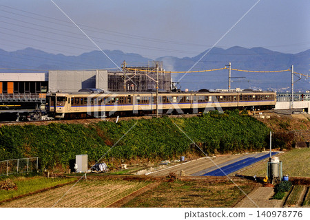 2007: Four 113 series out-of-service trains running along an embankment 2007: Four 113 series out-of-service trains running along an embankment 140978776
