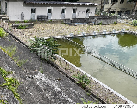 Unused school outdoor pool Unused school outdoor pool 140978897