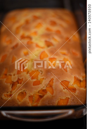 Fresh apricot loaf cake in baking pan Fresh apricot loaf cake in baking pan 140978930