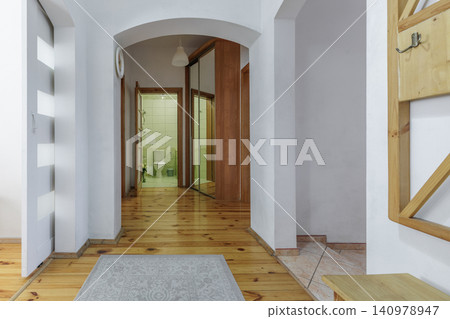 Bright Corridor Interior with Arch and Mirror Wardrobe Bright Corridor Interior with Arch and Mirror Wardrobe 140978947