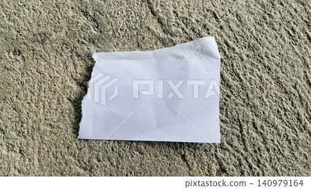 Torn White Paper Strip on Rough Gray Concrete Texture Background Torn White Paper Strip on Rough Gray Concrete Texture Background 140979164
