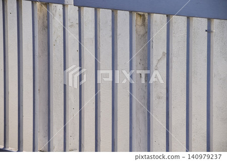 Close-up of metal corrugated board. Fence from corrugated board. Texture of metal fence. For background use. 140979237
