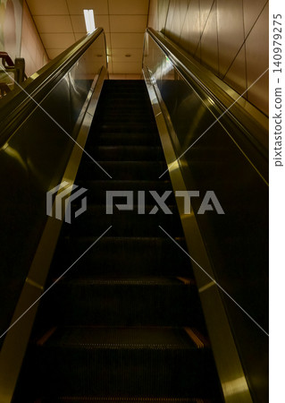 Close-up of the escalator. escalator convergence line. Indoor view. Close-up of the escalator. escalator convergence line. Indoor view. 140979275