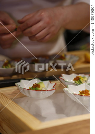 Chef Preparing Artisanal Dishes in Restaurant Setting Chef Preparing Artisanal Dishes in Restaurant Setting 140979804