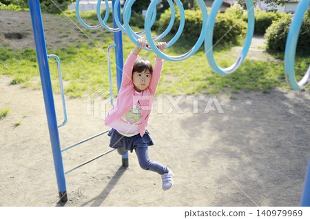 Infant (5-year-old) playing on a cloud ladder 140979969