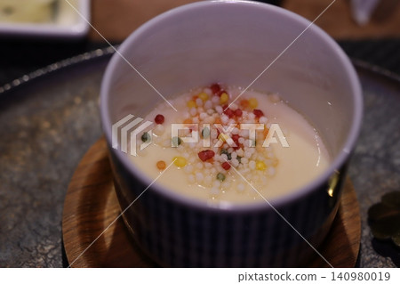 Creamy Soup with Colorful Grain Garnish Creamy Soup with Colorful Grain Garnish 140980019