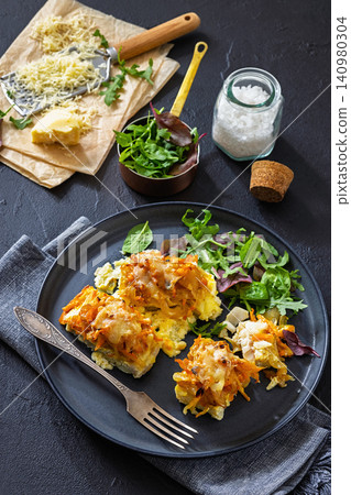 Cheesy Veggie Baked White Fish on a plate Cheesy Veggie Baked White Fish on a plate 140980304