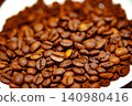 Coffee beans on a white plate. dark background 140980416
