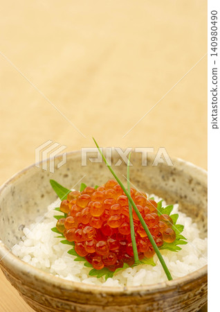 A Japanese delicacy: salmon roe rice served in a white bowl, garnished with green onions and bamboo leaves. A Japanese delicacy: salmon roe rice served in a white bowl, garnished with green onions and bamboo leaves. 140980490