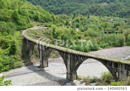 The bridge leading to the ghost town of Tkuarchal. Abkhazia The bridge leading to the ghost town of Tkuarchal. Abkhazia 140980563