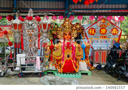 Golden deity statue and banner at Taipei Nanyueshe temple in Taipei Golden deity statue and banner at Taipei Nanyueshe temple in Taipei 140981557