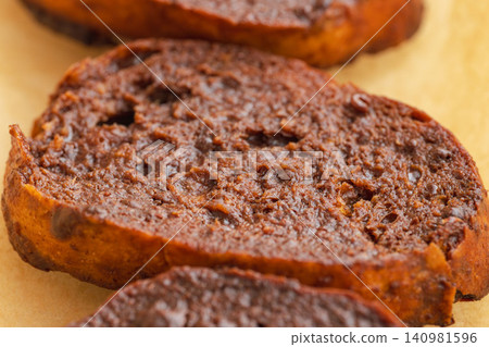 Close-up shot of chocolate rusks on parchment paper (13) Close-up shot of chocolate rusks on parchment paper (13) 140981596