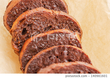 Close-up shot of chocolate rusks on parchment paper (18) Close-up shot of chocolate rusks on parchment paper (18) 140981601