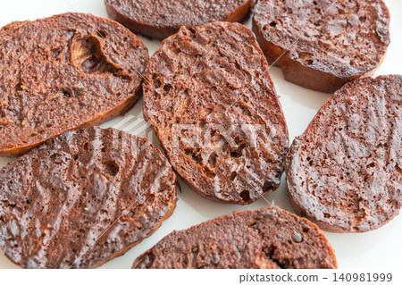 A close-up shot of delicious homemade chocolate rusks on a white plate. (26) A close-up shot of delicious homemade chocolate rusks on a white plate. (26) 140981999