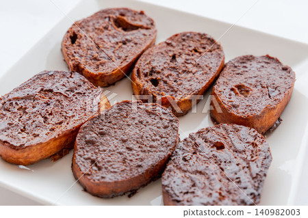 Homemade, delicious chocolate rusks placed on a white plate for a photo shoot (02) Homemade, delicious chocolate rusks placed on a white plate for a photo shoot (02) 140982003