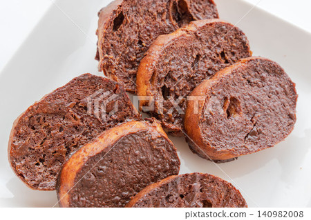Homemade, delicious chocolate rusks placed on a white plate for a photo shoot (07) Homemade, delicious chocolate rusks placed on a white plate for a photo shoot (07) 140982008