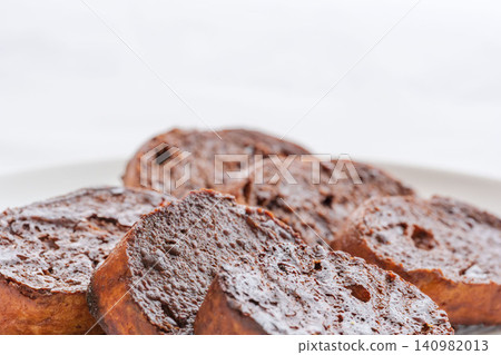 Homemade, delicious chocolate rusks placed on a white plate for a photo shoot (13) Homemade, delicious chocolate rusks placed on a white plate for a photo shoot (13) 140982013