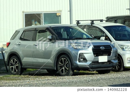 Passenger cars lining up in the parking lot 140982228