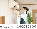 Female worker cleaning the house to clean the air conditioner 140982806
