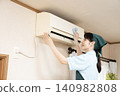Female worker cleaning the house to clean the air conditioner 140982808