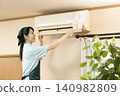 Female worker cleaning the house to clean the air conditioner 140982809