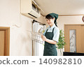 Female worker cleaning the house to clean the air conditioner 140982810