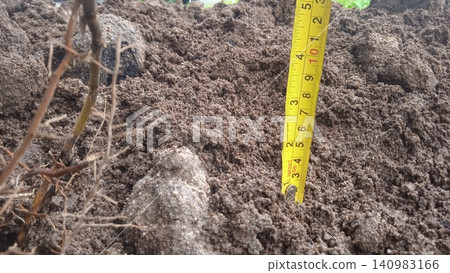 tape measure on the land tape measure on the land 140983166