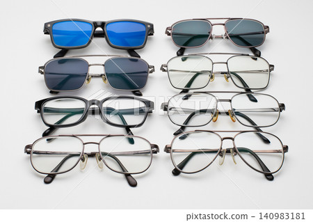 A comparison image showing variations of eyeglasses and sunglasses. A comparison image showing variations of eyeglasses and sunglasses. 140983181