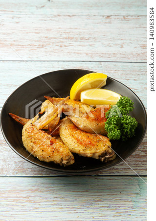 Herb-roasted chicken wings Herb-roasted chicken wings 140983584