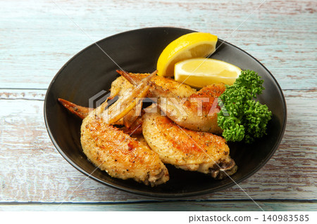 Herb-roasted chicken wings Herb-roasted chicken wings 140983585