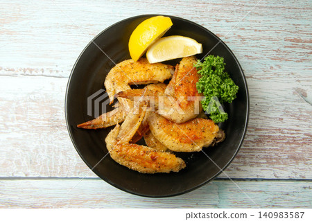 Herb-roasted chicken wings Herb-roasted chicken wings 140983587