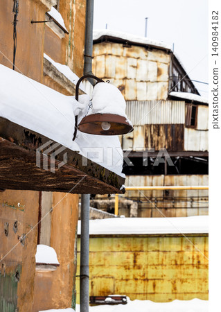 snow-covered front door canopy and street lamp snow-covered front door canopy and street lamp 140984182