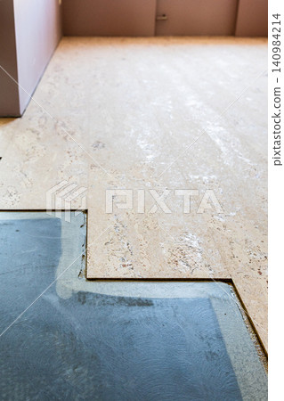 cork tiles glued to concrete base at floor in home cork tiles glued to concrete base at floor in home 140984214