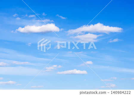 few small cirrus and cumulus clouds in blue sky few small cirrus and cumulus clouds in blue sky 140984222