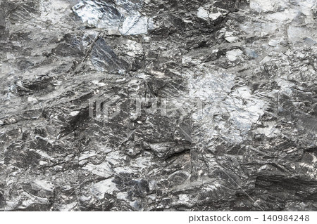 surface of raw anthraxolite shungite rock close-up surface of raw anthraxolite shungite rock close-up 140984248