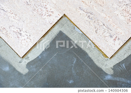 top view of cork tiles glued to concrete base 140984306