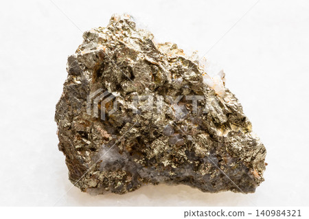 raw pyrite and chalcopyrite on quartz rock closeup raw pyrite and chalcopyrite on quartz rock closeup 140984321