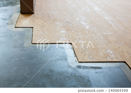 cork flooring tiles glued to concrete base in room cork flooring tiles glued to concrete base in room 140984399