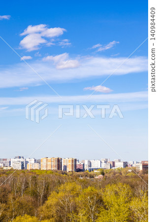 blue sky with cirrus clouds over city in spring blue sky with cirrus clouds over city in spring 140984409