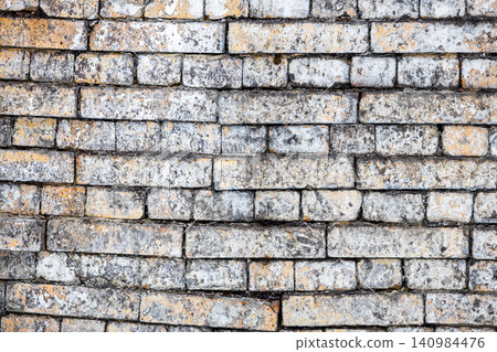 wall of sagging rows of bricks on old factory wall of sagging rows of bricks on old factory 140984476
