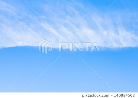 horizontal front of cirrus clouds in blue sky horizontal front of cirrus clouds in blue sky 140984508