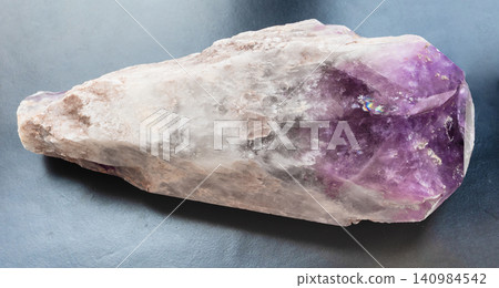 single natural amethyst crystal close-up on black single natural amethyst crystal close-up on black 140984542