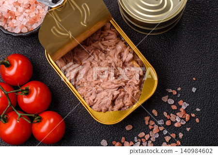 Fish, canned tuna chunks in brine for sandwiches and salads. Canned tuna 140984602