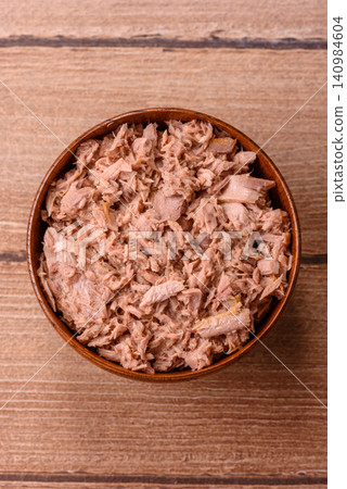 Fish, canned tuna chunks in brine for sandwiches and salads. Canned tuna Fish, canned tuna chunks in brine for sandwiches and salads. Canned tuna 140984604