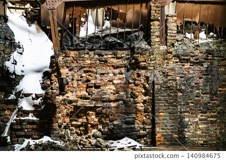 broken brick wall in abandoned factory building broken brick wall in abandoned factory building 140984675