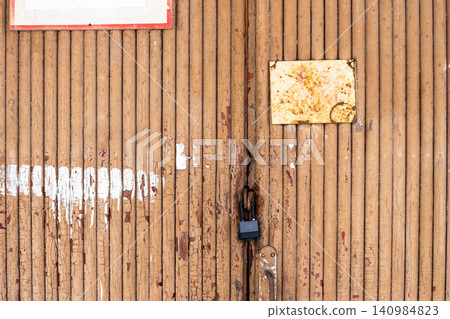 brown wooden logs painted closed doors of hangar brown wooden logs painted closed doors of hangar 140984823