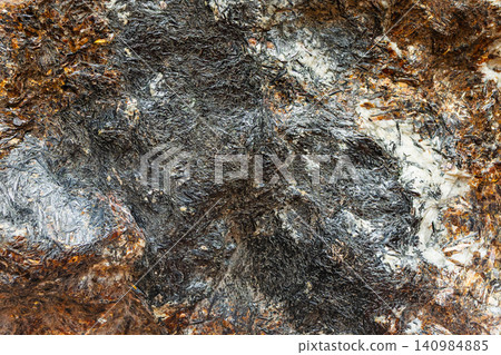 surface of unworked astrophyllite rock close-up surface of unworked astrophyllite rock close-up 140984885