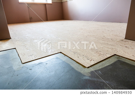 cork flooring tiles glued to concrete base in home cork flooring tiles glued to concrete base in home 140984930