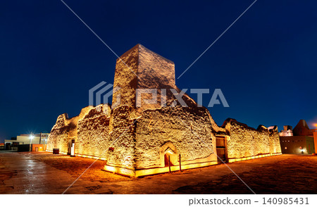 The historic mud brick ruins of At Turaif district in Diriyah Saudi Arabia illuminated at night under a clear blue sky The historic mud brick ruins of At Turaif district in Diriyah Saudi Arabia illuminated at night under a clear blue sky 140985431