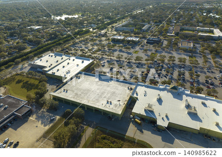 Many parked cars on store parking lot with lines and markings for parking places and directions. Place for vehicles in front of a shopping mall center Many parked cars on store parking lot with lines and markings for parking places and directions. Place for vehicles in front of a shopping mall center 140985622